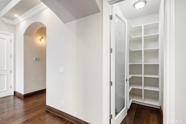 4976 Odessa Ave, Encino, CA 91436 - bathroom featuring a walk in closet, hardwood / wood-style flooring, crown molding, and baseboards