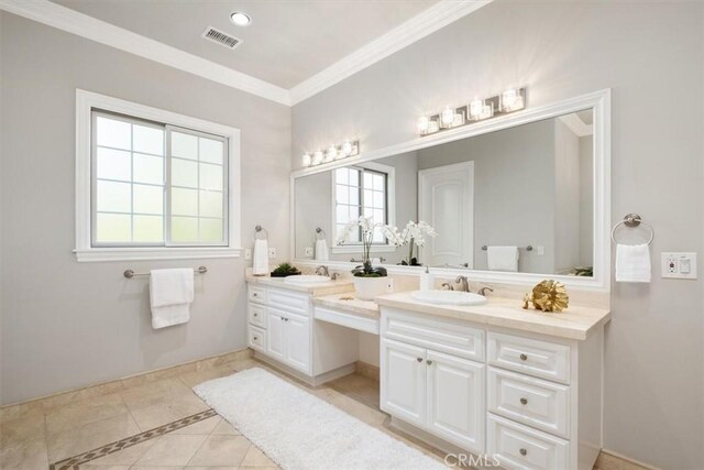 4976 Odessa Ave, Encino, CA 91436 - bathroom featuring crown molding, double vanity, a sink, and tile patterned floors