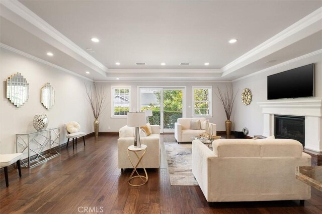 4976 Odessa Ave, Encino, CA 91436 - living room featuring a glass covered fireplace, recessed lighting, a raised ceiling, and dark wood finished floors