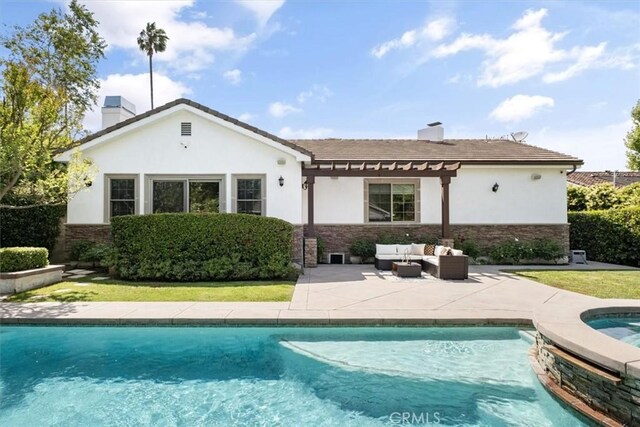 4976 Odessa Ave, Encino, CA 91436 - rear view of house featuring a pergola, stone siding, an outdoor hangout area, and a chimney