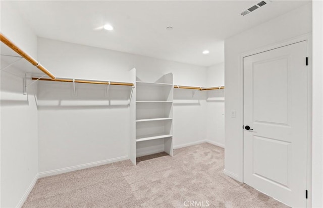 walk in closet with carpet floors and visible vents