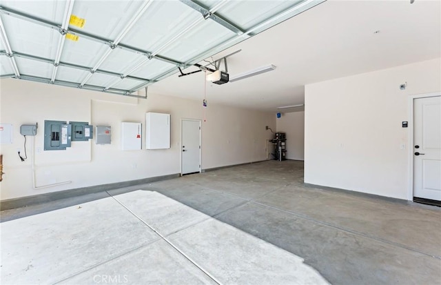 garage featuring a garage door opener and electric panel