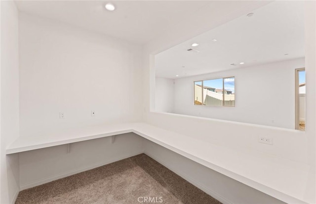 interior space featuring carpet, baseboards, and recessed lighting