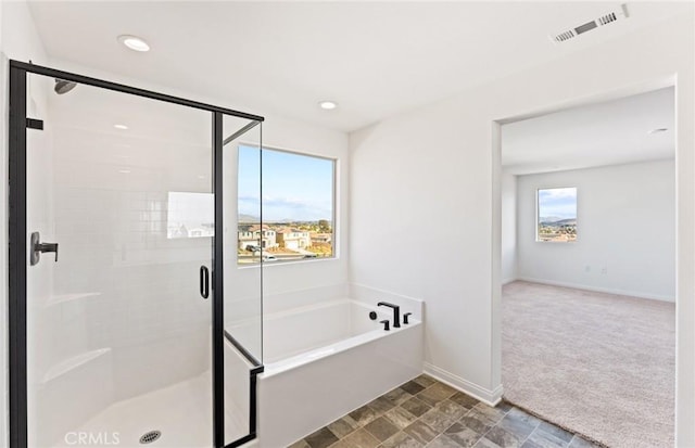 bathroom featuring recessed lighting, visible vents, a shower stall, baseboards, and a bath