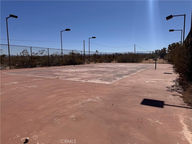 view of sport court with fence