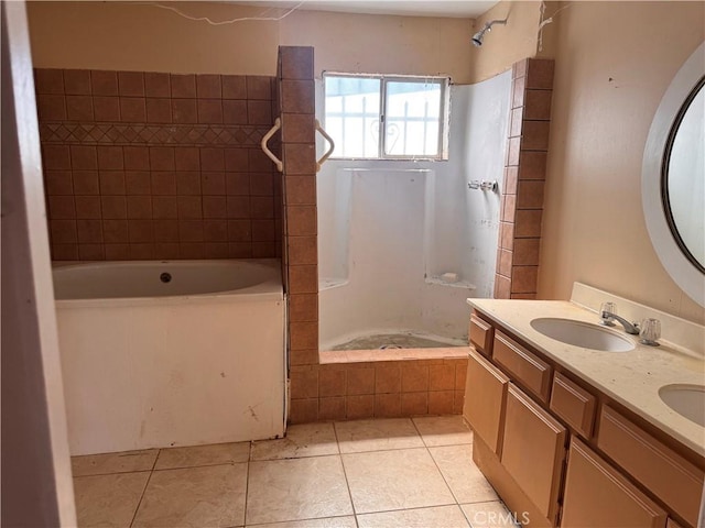 bathroom with tile patterned flooring, double vanity, and a sink