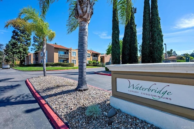 community / neighborhood sign featuring a residential view