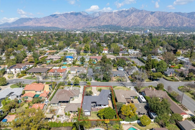 aerial view with a mountain view and a residential view