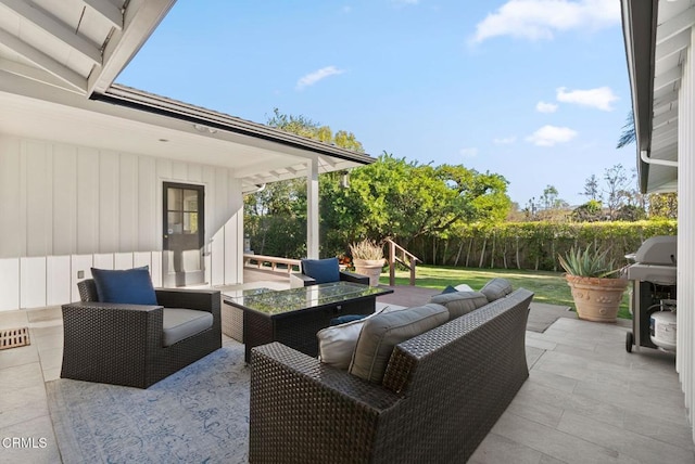 view of patio / terrace featuring outdoor lounge area, fence, and grilling area