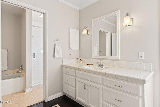 bathroom featuring vanity, a shower stall, tile patterned floors, and ornamental molding