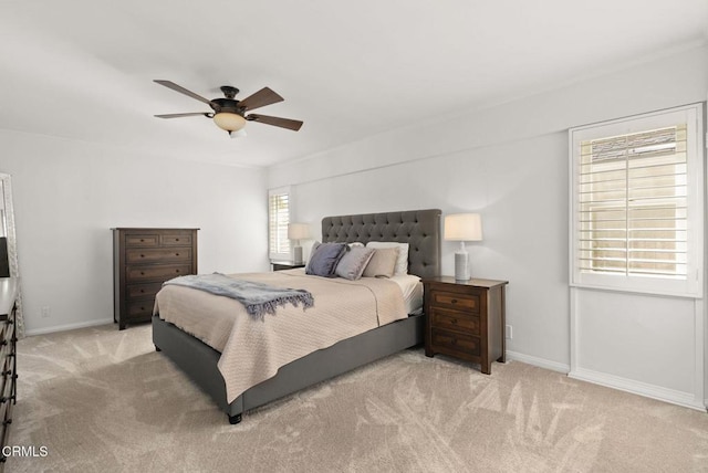 bedroom featuring carpet flooring, ceiling fan, and baseboards