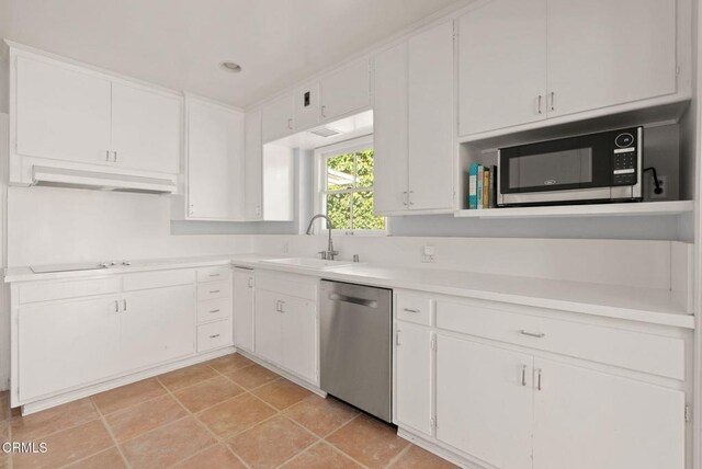 kitchen with a sink, under cabinet range hood, stainless steel dishwasher, white cabinets, and light countertops