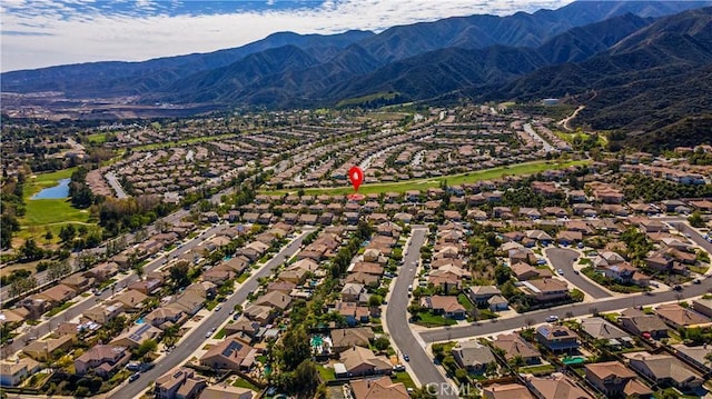 birds eye view of property featuring a residential view and a water and mountain view