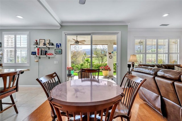 dining space featuring crown molding, recessed lighting, visible vents, and plenty of natural light