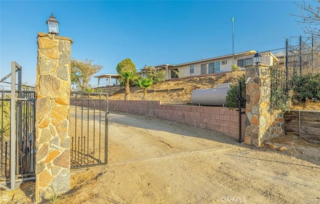 view of gate featuring fence