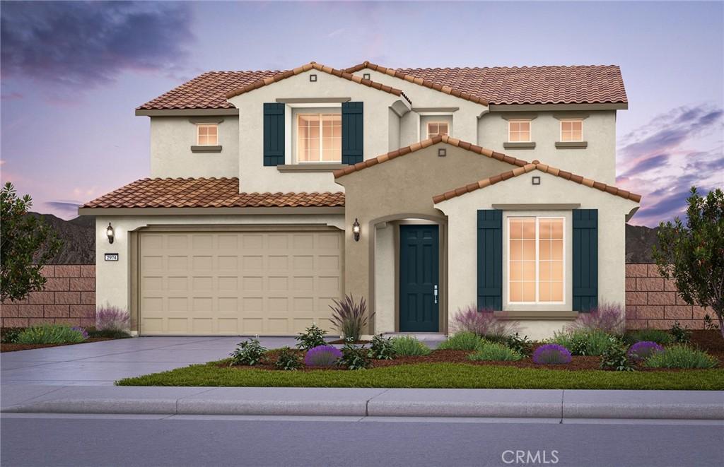 mediterranean / spanish home with driveway, an attached garage, fence, and stucco siding