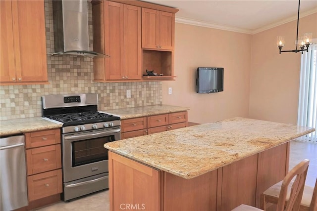 kitchen with crown molding, tasteful backsplash, appliances with stainless steel finishes, a kitchen island, and wall chimney exhaust hood