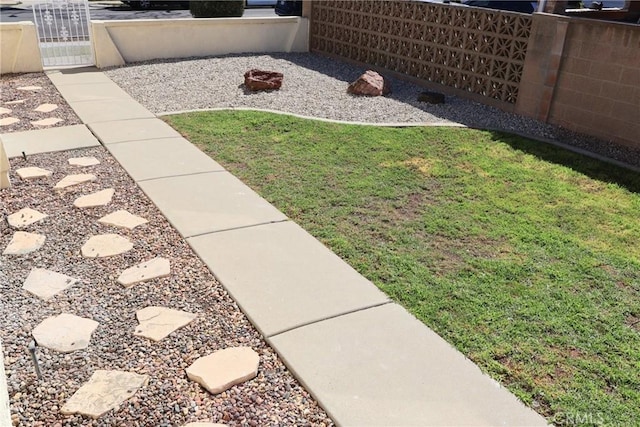 view of yard featuring a gate and fence