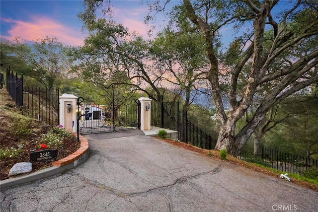 gate at dusk with fence