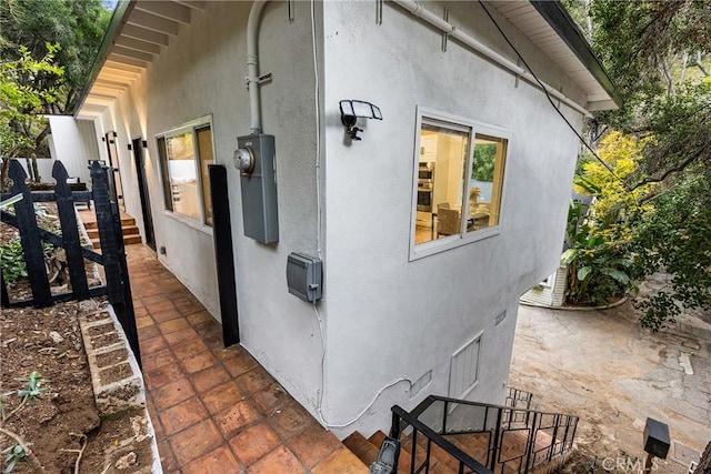 view of property exterior with a patio and stucco siding