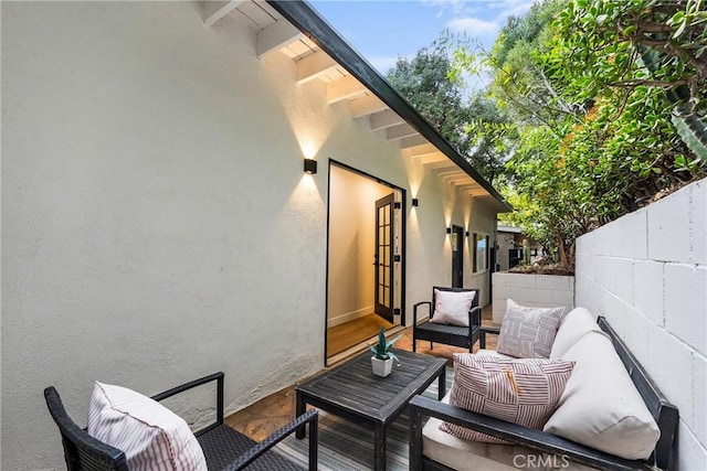 view of patio with an outdoor hangout area and fence