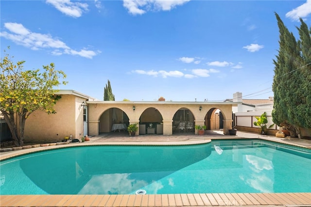 view of swimming pool with fence and a fenced in pool