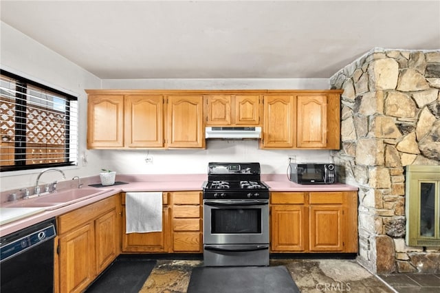 kitchen with light countertops, a sink, under cabinet range hood, and black appliances