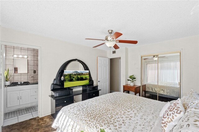 bedroom with carpet, a closet, visible vents, and a textured ceiling