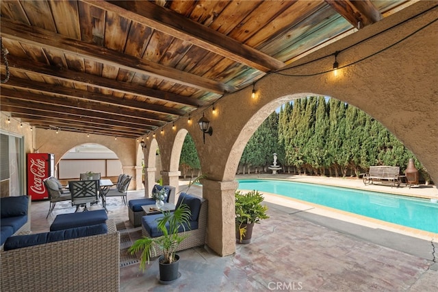 pool featuring outdoor dining area, a patio, and an outdoor hangout area