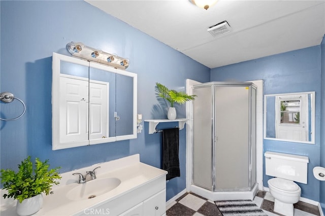 full bathroom featuring visible vents, toilet, tile patterned floors, vanity, and a shower stall