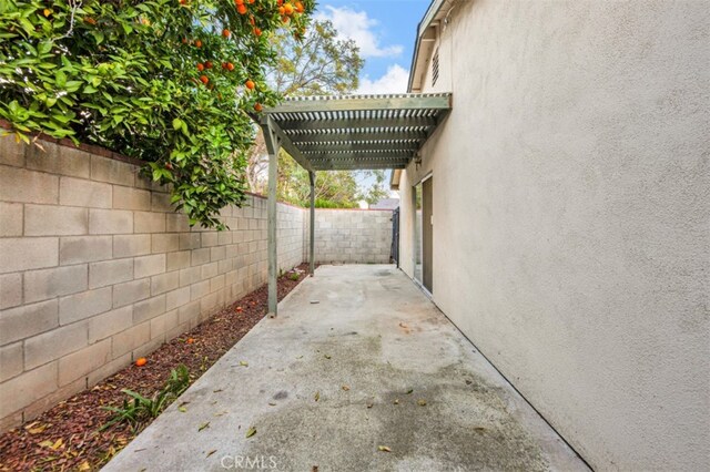 view of patio featuring a fenced backyard and a pergola