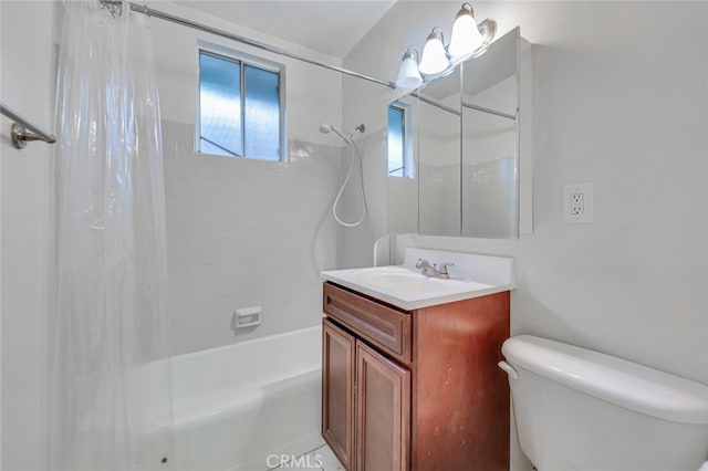 bathroom with shower / tub combo, vanity, and toilet