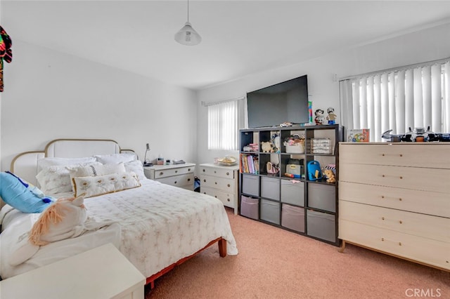 bedroom featuring light colored carpet