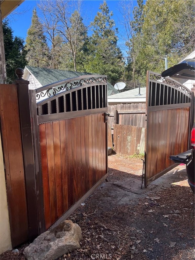 view of gate featuring fence