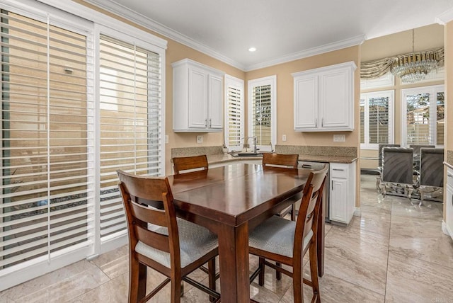 dining room with crown molding and recessed lighting