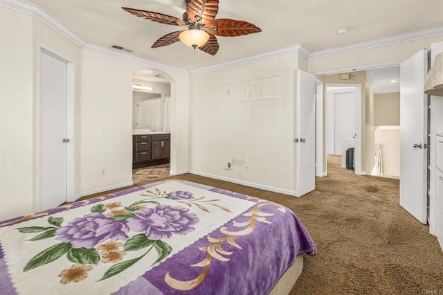 carpeted bedroom featuring arched walkways, visible vents, baseboards, and ornamental molding