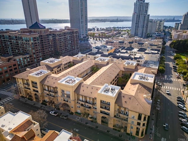 aerial view with a city view and a water view