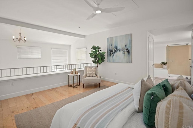 bedroom with an inviting chandelier, vaulted ceiling with beams, baseboards, and wood finished floors