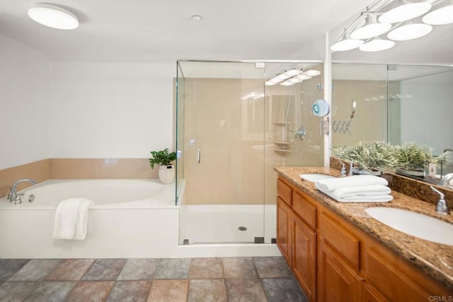 bathroom featuring a garden tub, a sink, and a shower stall