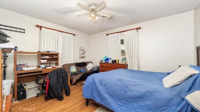 17043 Randall Ave, Fontana, CA 92335 - bedroom featuring wood finished floors, a textured ceiling, and ceiling fan