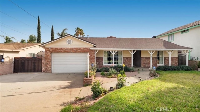 ranch-style home featuring a garage, concrete driveway, fence, a front lawn, and brick siding