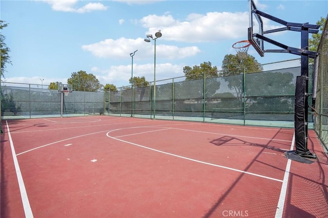 view of sport court featuring community basketball court and fence