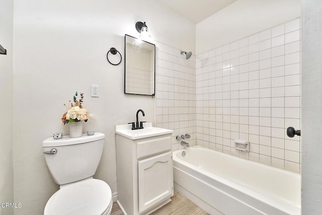 bathroom with shower / bathing tub combination, vanity, and toilet