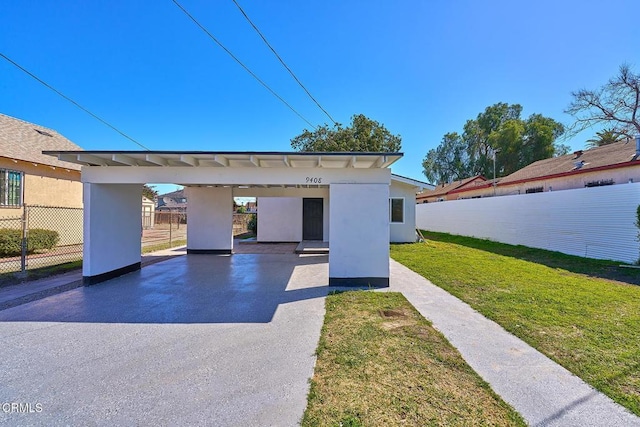 exterior space with an outbuilding, a front yard, and fence