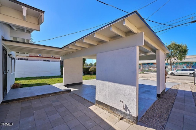 view of patio / terrace featuring fence