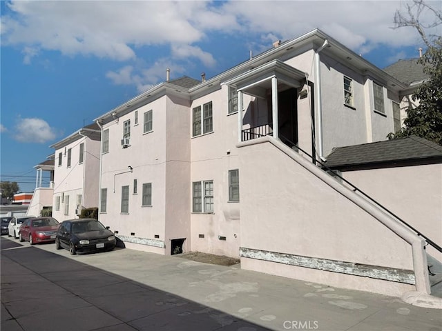 view of side of home featuring stucco siding