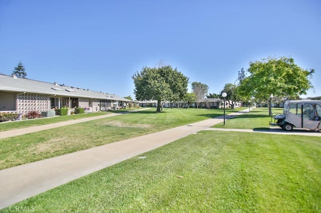 view of home's community featuring a lawn