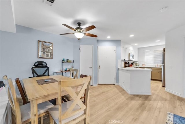 dining room with visible vents, baseboards, ceiling fan, light wood-type flooring, and recessed lighting