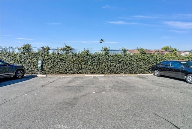 uncovered parking lot with fence