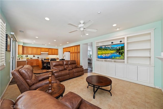 living room with a ceiling fan, light tile patterned flooring, recessed lighting, and baseboards